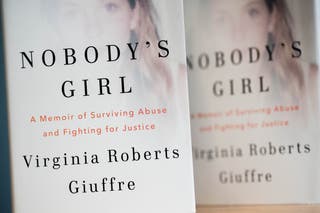 Copies of Nobody's Daughter by Virginia Roberts Giuffre, co-written by Amy Wallace (James Manning/PA)